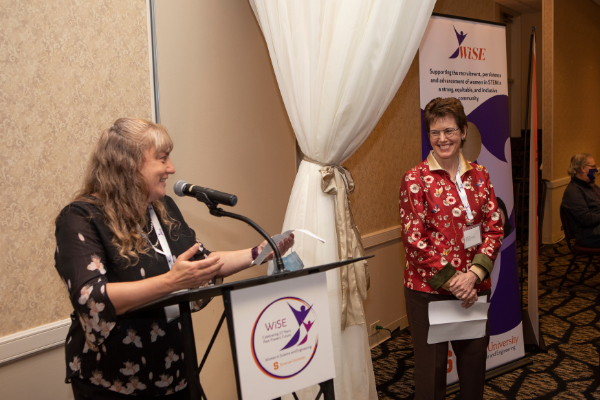 Dr. Kate Lewis (left) introducing Provost Gretchen Ritter (right)